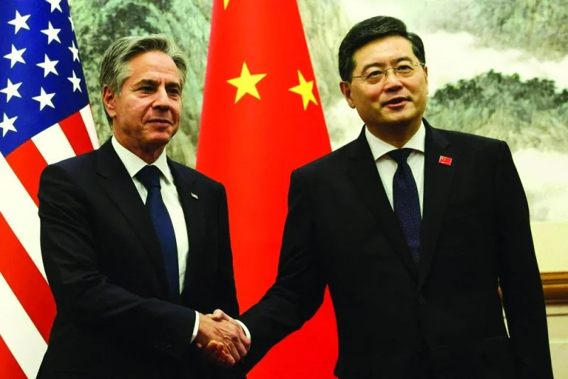 US Secretary of State Antony Blinken (left) and Chinese Foreign Minister Qin Gang shake hands ahead of a meeting at the Diaoyutai State Guesthouse in Beijing on Sunday. (AFP)