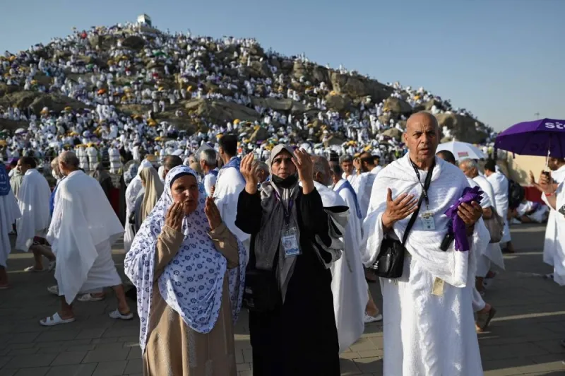 Libyan pilgrim Abdel Latif Abdel Wahab (right) prays along with family members in Saudi Arabia&#039;s Mount Arafat, during the Haj pilgrimage, yesterday.