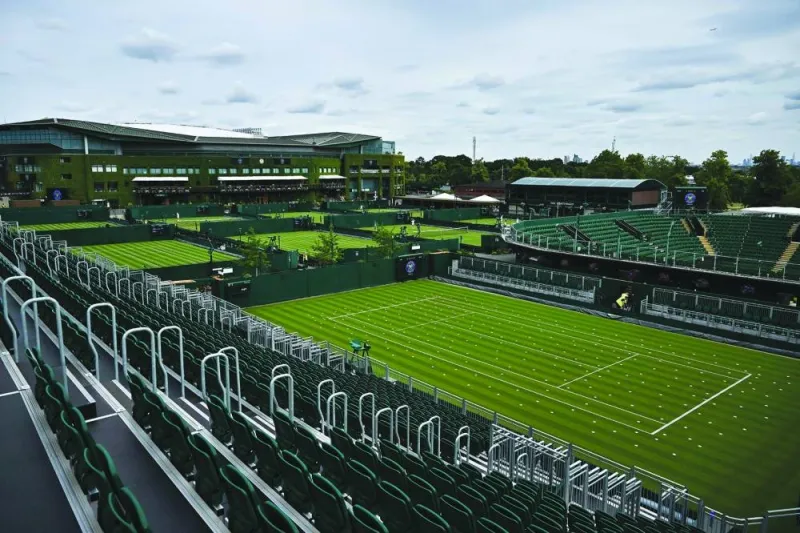 A photograph taken on Tuesday shows court 12 covered in dots in order to calibrate the Hawk-Eye, a system used to visually track the trajectory of the ball, at the All England Lawn Tennis Club in west London, the week before the Wimbledon Championships tennis tournament are due to start on July 3. (AFP)