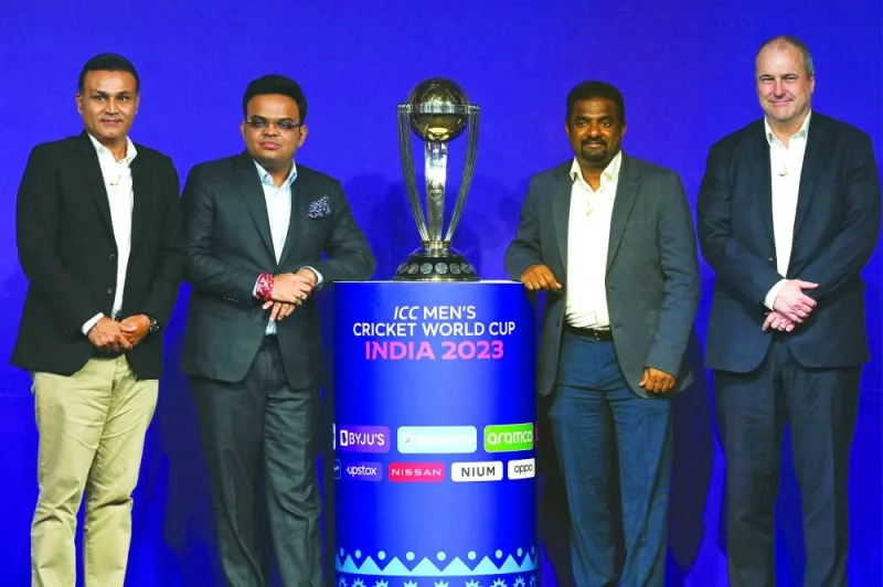 Former Indian player Virender Sehwag (left), BCCI Secretary Jay Shah (second from left), former Sri Lankan player Muttiah Muralitharan (second from right) and ICC Chief Executive Geoff Allardice pose with the trophy of the upcoming Men’s Cricket World Cup during an event announcing the tournament’s schedule in Mumbai on Tuesday. (AFP)