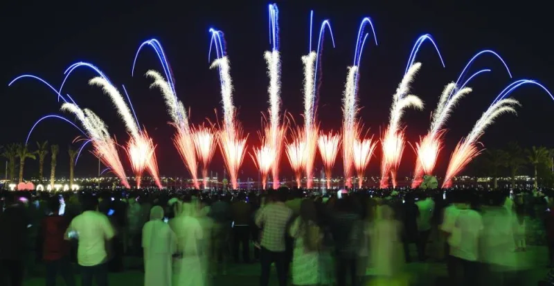 People stand in awe of the captivating fireworks at Lusail Boulevard Wednesday.