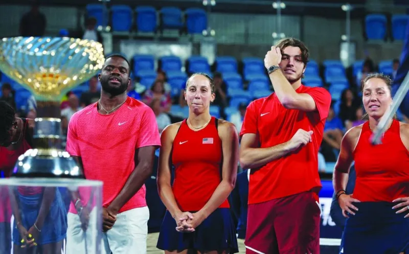 
American tennis players Frances Tiafoe (left), Taylor Fritz (second right), Madison Keys (second left) and Jessica Pegula celebrate next to the trophy after winning the United Cup at Ken Rosewall Arena, Sydney, Australia, on January 8, 2023. (Reuters) 