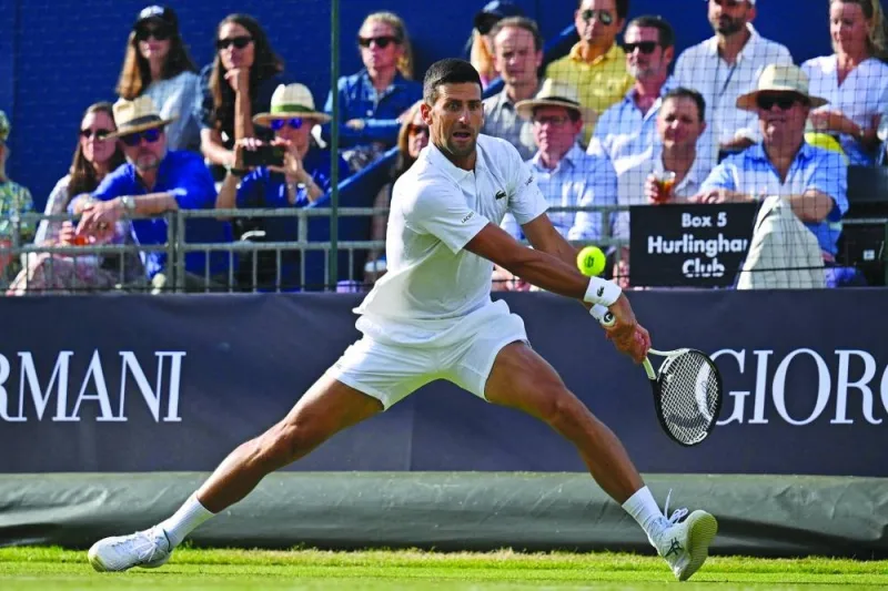 Serbia’s Novak Djokovic returns to US player Frances Tiafoe during an exhibition match at The Giorgio Armani Tennis Classic tournament at the Hurlingham Club in London on Friday. (AFP)