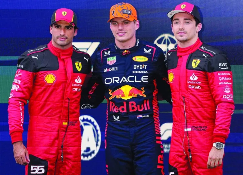 First-placed Red Bull Racing’s driver Max Verstappen (centre) pose with third-placed Ferrari’s driver Carlos Sainz (left), second-placed Ferrari’s driver Charles Leclerc after the qualifying session at the Red Bull race track in Spielberg, Austria, on Friday. (AFP)