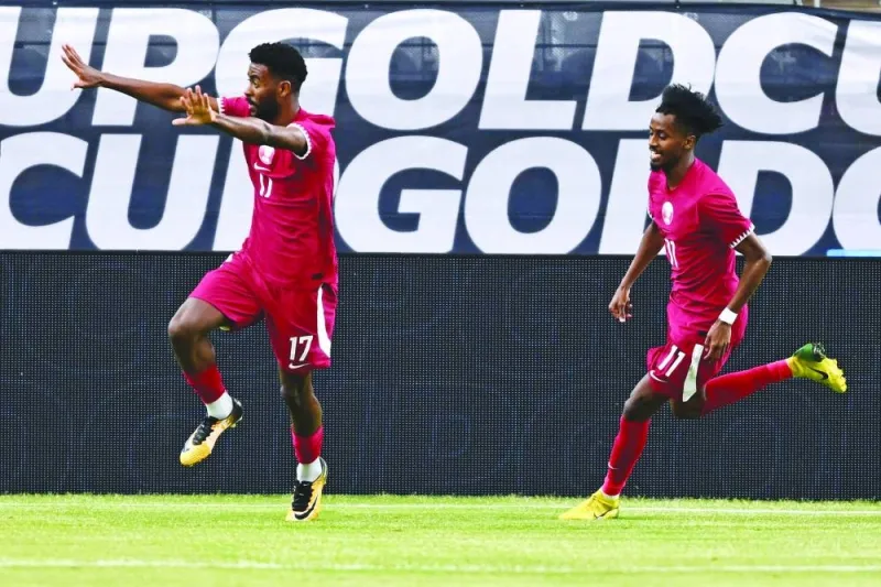 
Qatar’s forward Tameem Alabdulla (left) celebrates after scoring a goal against Honduras during the Concacaf Gold Cup Group B match at the State Farm stadium, in Glendale, Arizona. (AFP) 