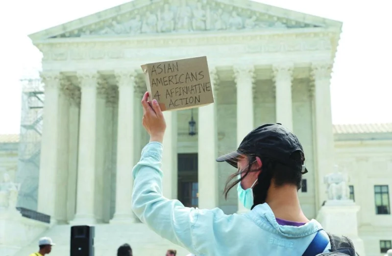
An Asian American supporter of affirmative action policies protests outside the US Supreme Court, a day after the court struck down race-conscious admissions programmes at Harvard University and the University of North Carolina, effectively prohibiting affirmative action policies long used to raise the number of black, Hispanic and other underrepresented minority students on American campuses. 