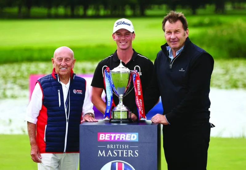 New Zealand’s Daniel Hillier celebrates winning the British Masters with the trophy, Nick Faldo and Fred Done. (Reuters)
