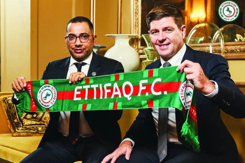 
Ettifaq’s new English manager Steven Gerrard (right) with the club’s president Khaled al-Debel after signing with them in London. (AFP) 