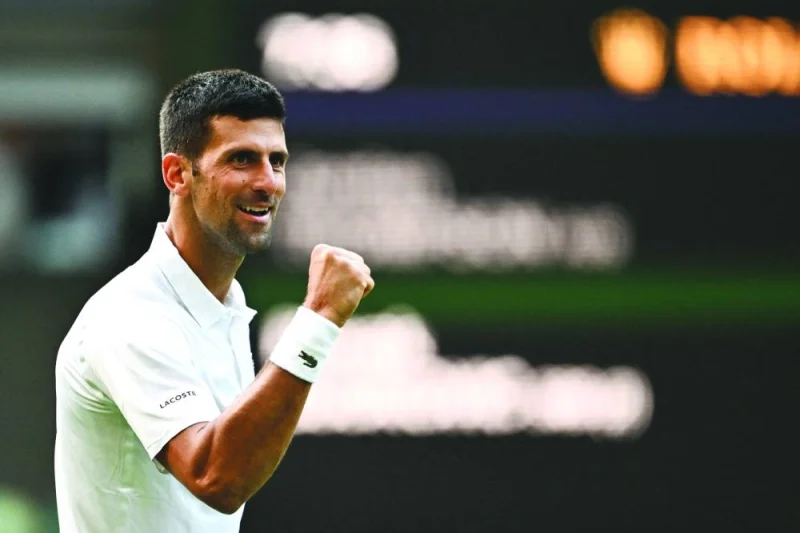 Serbia's Novak Djokovic celebrates after winning against Australia's Jordan Thompson during their match on the third day of the 2023 Wimbledon Championships at The All England Tennis Club in Wimbledon, southwest London, yesterday. (AFP)