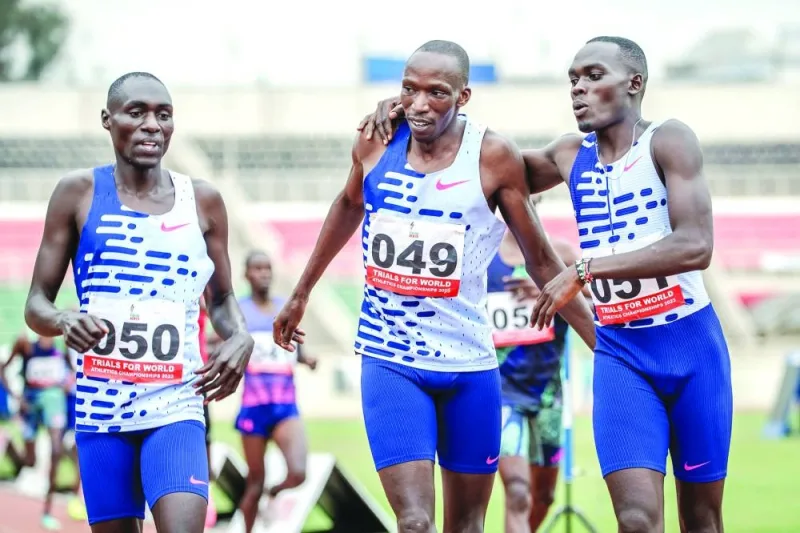 Kenya’s Timothy Cheruiyot (centre), Reynold Cheruiyot (right) and Abel Kipsang celebrate their qualification for the World Athletics Championships after finishing the men’s 1,500m final at the national trials for World Athletics Championships in Nairobi on Saturday. (AFP)