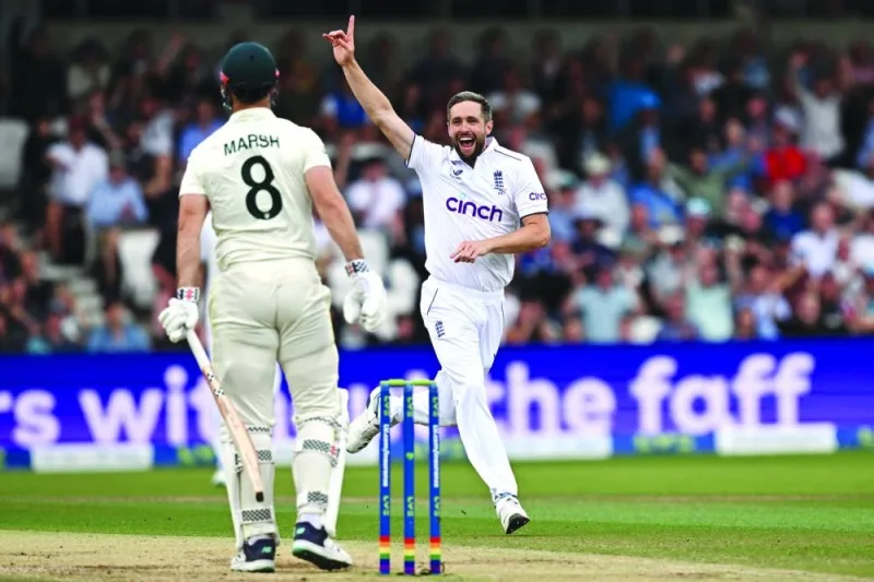 England’s Chris Woakes celebrates taking the wicket of Australia’s Mitchell Marsh (left) on day three of the third Ashes Test at Headingley cricket ground in Leeds on Saturday. (AFP)