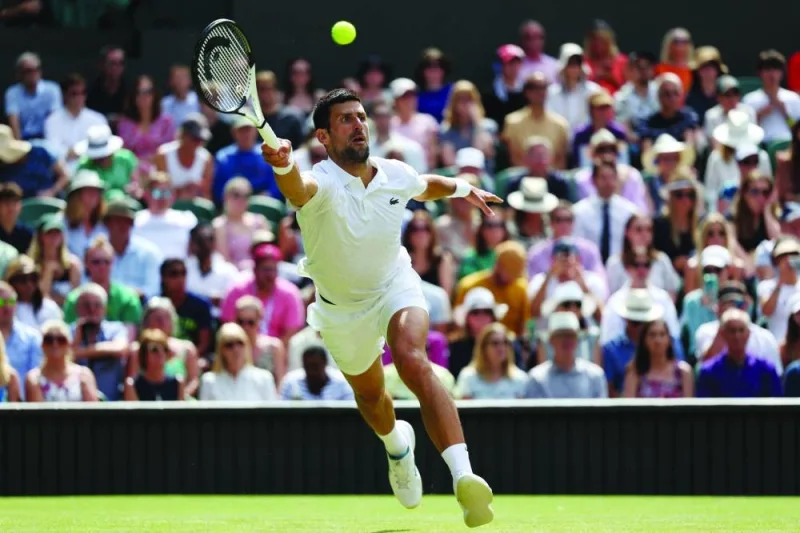
Serbia’s Novak Djokovic returns the ball to Poland’s Hubert Hurkacz during their pre-quarter-final match of the 2023 Wimbledon Championships. (AFP) 
