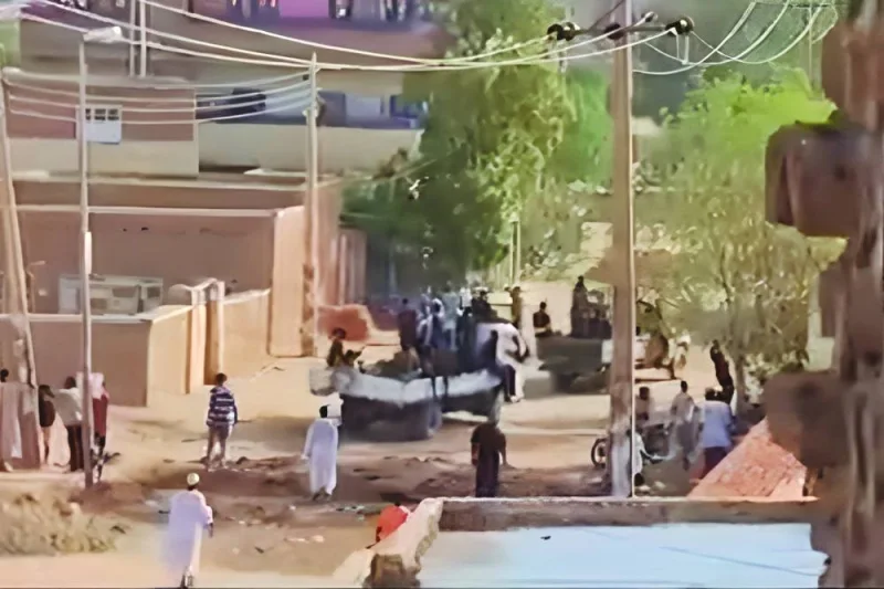
This frame grab taken from AFPTV video footage shows Sudanese armed forces driving military vehicles through a street in Omdurman. 