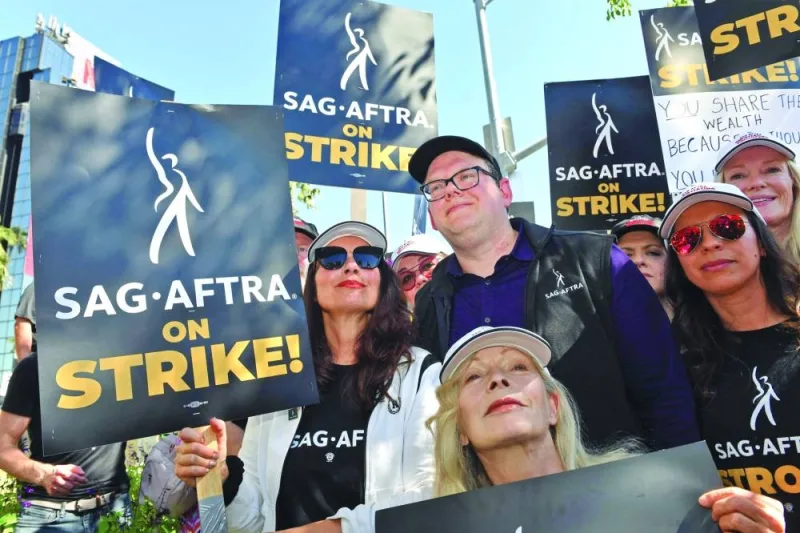 
SAG-AFTRA president Fran Drescher (centre left) and others join WGA members at a picket line yesterday outside Netflix offices in Los Angeles. 