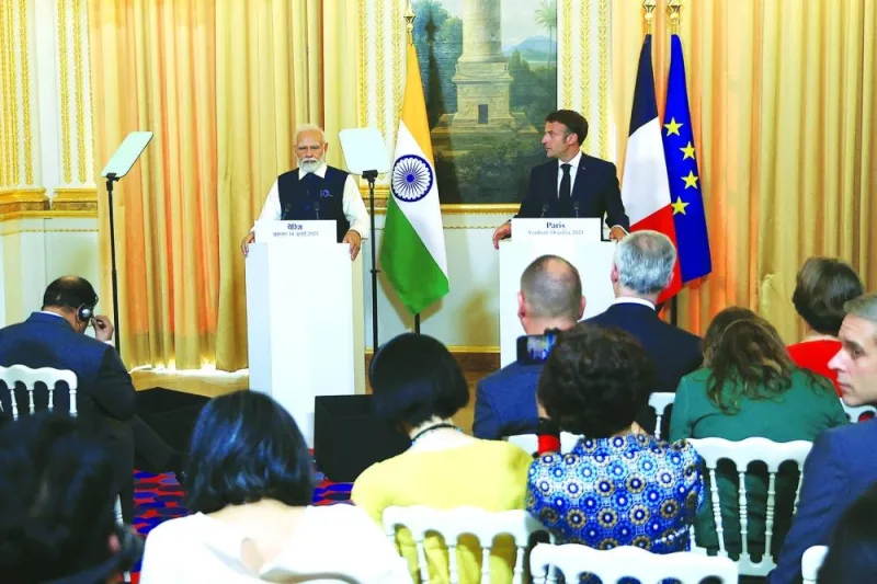 Indian Prime Minister Narendra Modi and French President Emmanuel Macron attend a joint press conference at the Elysee Palace in Paris, France, yesterday.