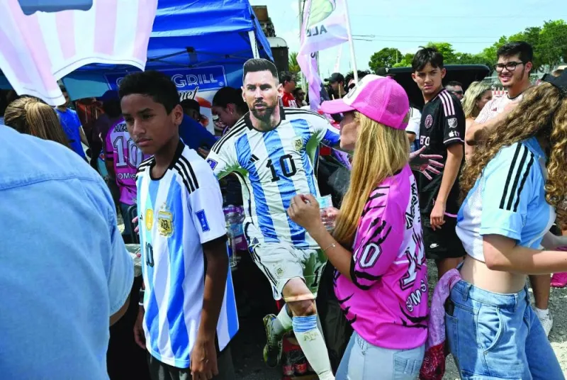 
Fans gather outside DRV PNK Stadium in Fort Lauderdale, Florida, yesterday, prior to the presentation of Argentine star Lionel Messi as the newest player for Major League Soccer’s Inter Miami . (AFP) 