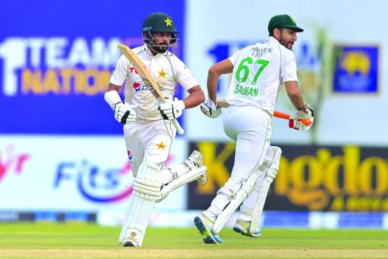 
Pakistan’s Agha Salman (right) and Saud Shakeel run between the wickets during the second day of the first Test against Sri Lanka in Galle yesterday. (AFP) 