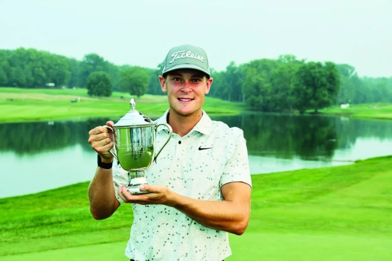 
Vincent Norrman of Sweden celebrates with the trophy after winning on the 18th hole during the sudden death playoff against Nathan Kimsey of England in the final round of the Barbasol Championship at Keene Trace Golf Club in United States. (AFP) 