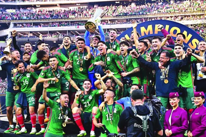 
Mexico’s goalkeeper Guillermo Ochoa (centre) holds up the trophy as he and teammates celebrate after they won the CONCACAF 2023 Gold Cup defeating Panama in the final at SoFi Stadium in Inglewood, California. (AFP) 