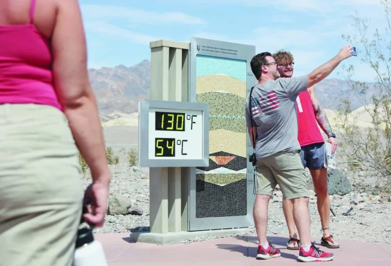 
Tourists takes a photo next to a digital display of an unofficial heat reading at the Furnace Creek Visitor Centre in California’s Death Valley National Park. 