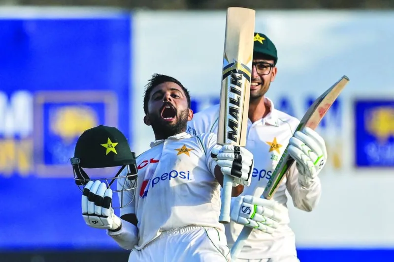 Pakistan’s Saud Shakeel celebrates after reaching his double century during the third day of the first Test against Sri Lanka in Galle on Tuesday. (AFP)