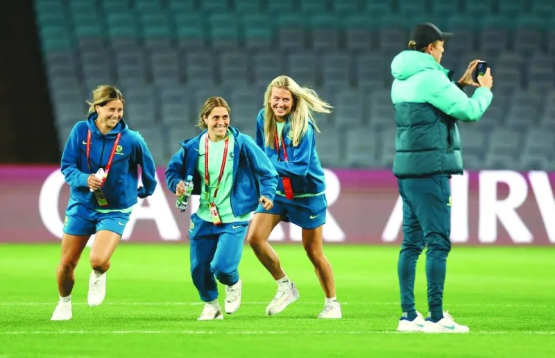 Australian players Katrina Gorry, Charlotte Grant and Kyra Cooney-Cross during a visit to the Stadium Australia in Sydney on Wednesday, on the eve of their FIFA Women’s World Cup opening match. (Reuters)