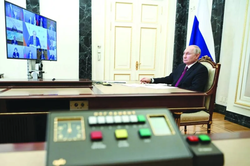 Russian President Vladimir Putin chairs a meeting with members of the government, via video link in Moscow on Wednesday. (Reuters)