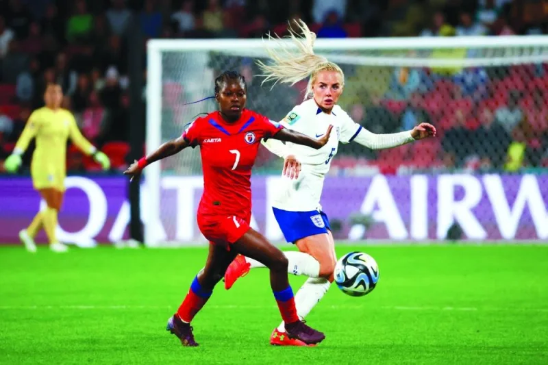 Haiti’s Batcheba Louis (left) and England’s Alex Greenwood vie for the ball during the FIFA Women’s World Cup Group D match in Brisbane  on Saturday. (AFP)
