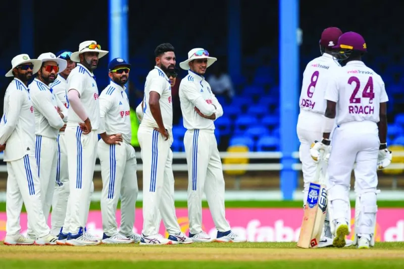 FROM LEFT: India’s Ravindra Jadeja, Rohit Sharma, Ravichandran Ashwin, Ajinkya Rahane, Mohamed Siraj and Shubman Gill look at 
Alzarri Joseph (8) of West Indies while waiting for the third umpire’s review during the fourth day of the second Test at Queen’s Park Oval in Port of Spain, Trinidad and Tobago, on Sunday. (AFP)