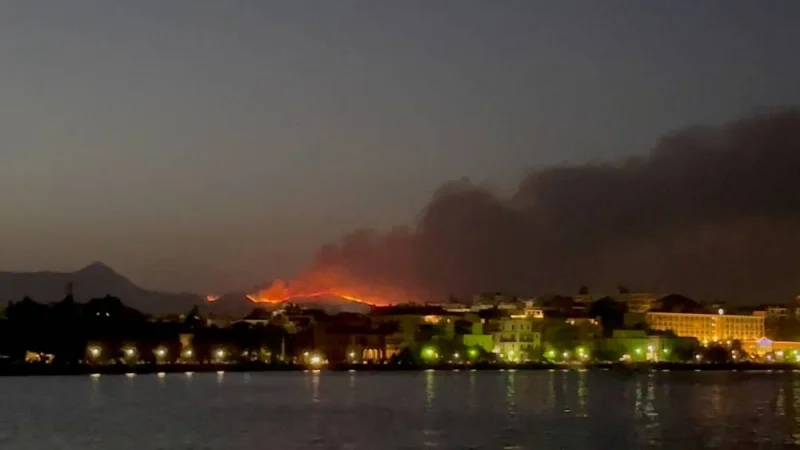 Smoke rises from a wildfire on Corfu Island, Greece, July 23, 2023 in this still image obtained from social media video.   Julia Dzhyzhevska/via REUTERS