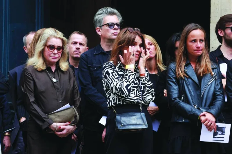 
Benjamin Biolay, Catherine Deneuve, relatives and friends leave after the funeral ceremony at Church of Saint-Roch in Paris yesterday. Right: Jane Birkin’s daughters French-British actresses Charlotte Gainsbourg (left) and Lou Doillon at the funeral. (Reuters/ AFP) 