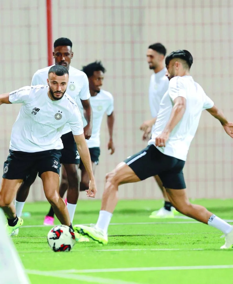 Al Sadd’s new signing Romain Saiss (left) with other teammates during a training session on Wednesday.