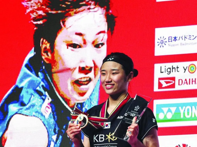 An Se Young of South Korea poses with Japan Open trophy in Tokyo on Sunday. (AFP)