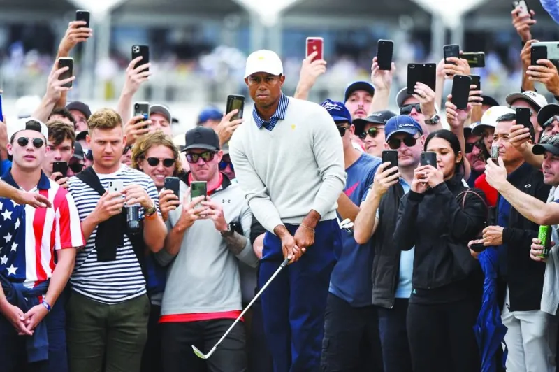 (File photo) US player Tiger Woods chips onto the green during the second day of the Presidents Cup golf tournament in Melbourne on December 13, 2019. (AFP)