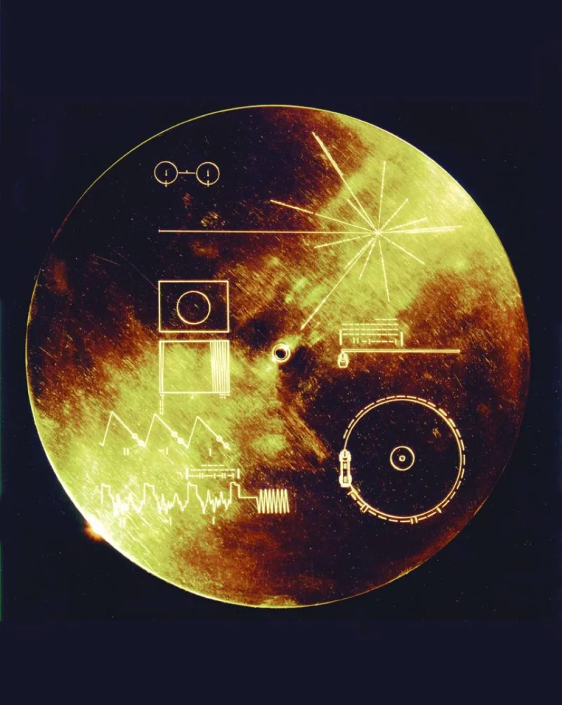 
This 1977 Nasa file image shows a gold aluminium cover that was designed to protect the Voyager 1 and 2 Sounds of Earth gold-plated records from micrometeorite bombardment, but also serves a double purpose in providing the finder a key to playing the record. 