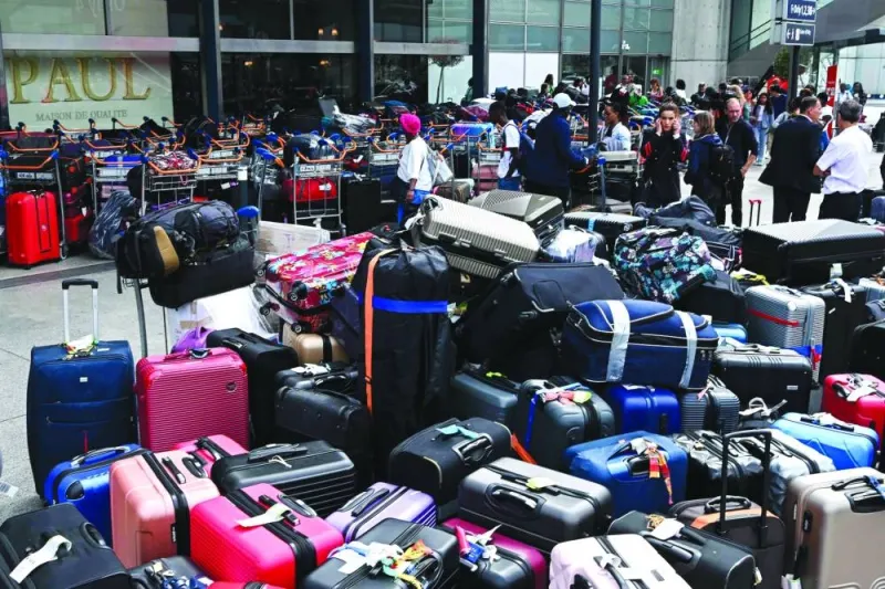 
Stacks of passenger luggage are seen outside the entrance of the Orly 4 terminal, after a technical incident at the Paris-Orly Airport, in Orly. 