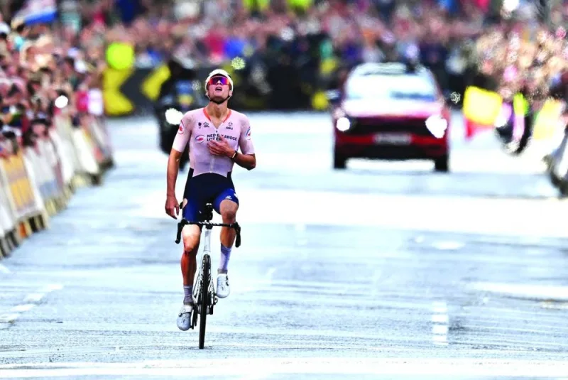 Netherland’s Mathieu van der Poel reacts after winning the men’s Elite Road Race at the Cycling World Championships in Edinburgh, Scotland, on Sunday. (AFP)