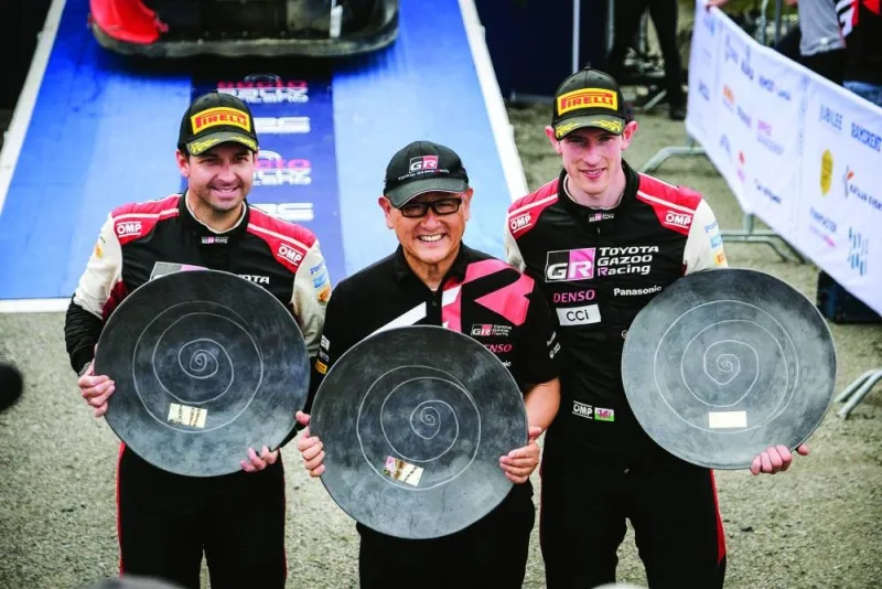 Winners, Toyota’s British driver Elfyn Evans (right) and and co-driver Scott Martin (left) celebrating with Toyota 
Chairman Akio Toyoda after the WRC Rally Finland in Jyvaskyla, Finland, on Sunday. (AFP)