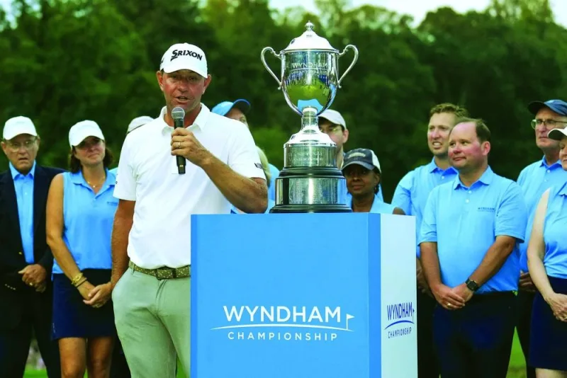 Lucas Glover speaks to the fans after winning the Wyndham Championship golf tournament. (USA TODAY Sports)