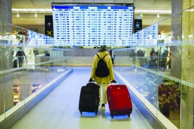 A passenger wheels luggage through the departures terminal at Paris Charles de Gaulle airport. Travelling light will make any trip less stressful. While a traveller saves time and money, by doing so, one may even get to enjoy one’s destination even better!