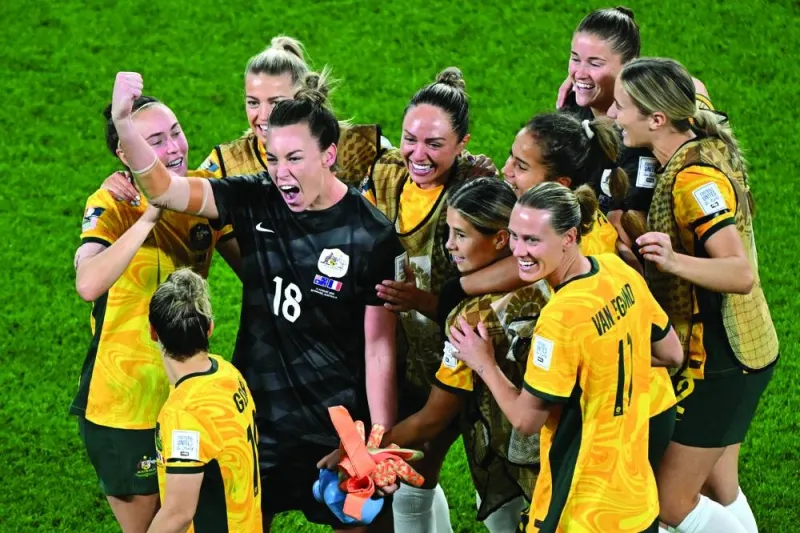 Australia’s players celebrate their shoot-out victory over France in the Women’s World Cup quarter-final in Brisbane on Saturday. (AFP)