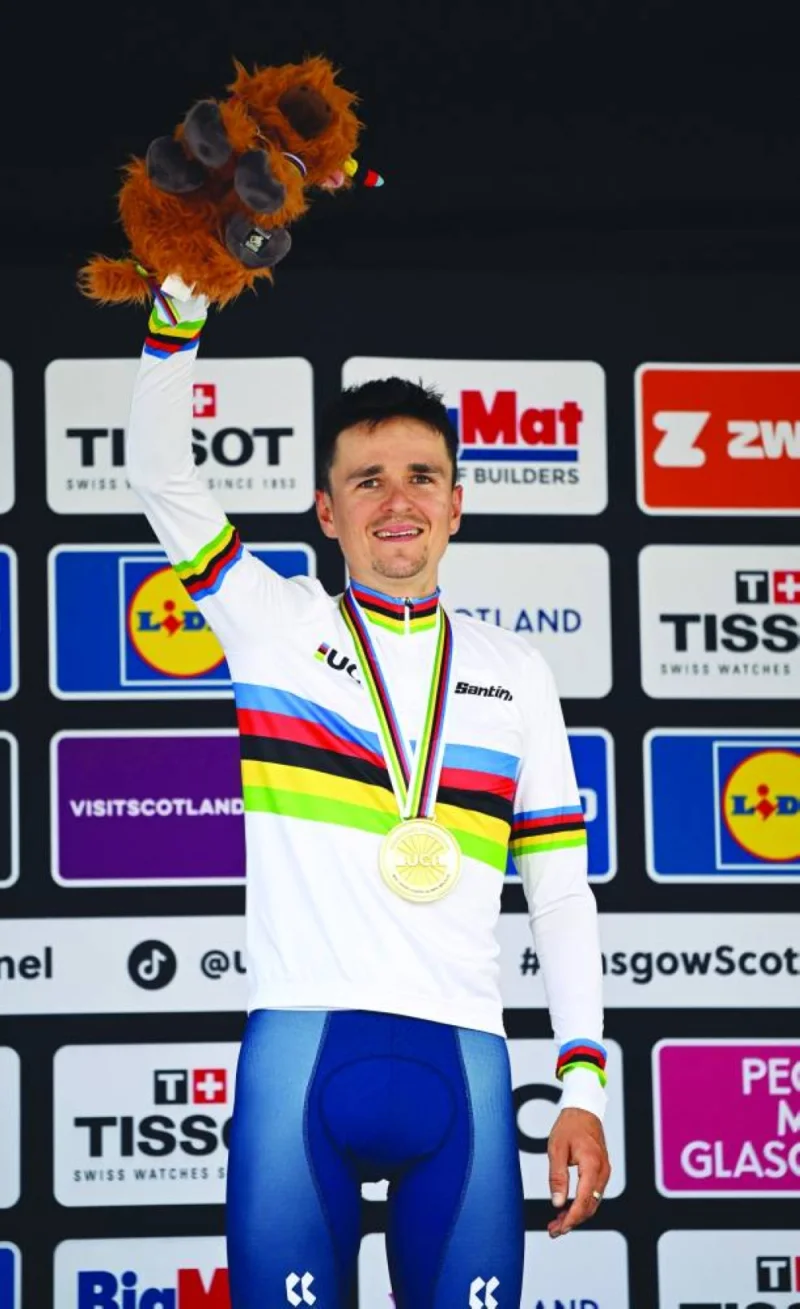 Great Britain’s Thomas Pidcock celebrates winning gold in the men’s Elite cross country Olympic mountain bike race during the Cycling World Championships in Glentress Forest, Scotland, on Saturday. New Zealand’s Samuel Gaze won silver and Switzerland’s Nino Schurter won bronze. (AFP)