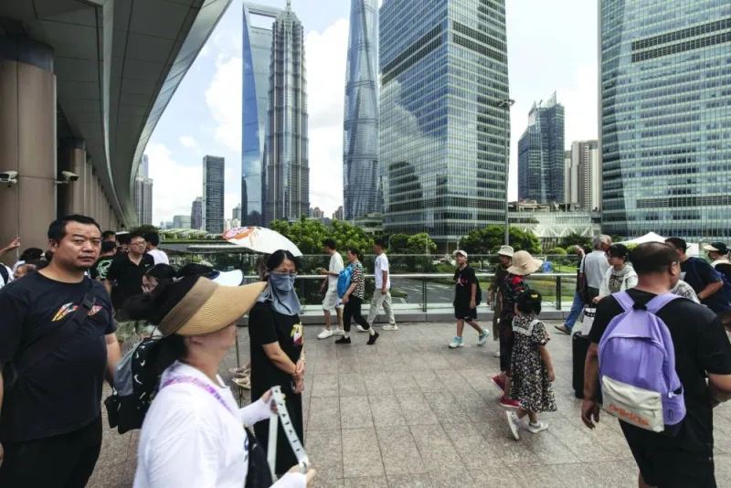 
Pedestrians in Pudong’s Lujiazui Financial District in Shanghai. China will allow provincial-level governments to raise about $139bn via bond sales to repay the debt of local-government financing vehicles and other 
off-balance sheet issuers, a small step towards addressing one of the biggest threats to the nation’s economy and financial stability. 