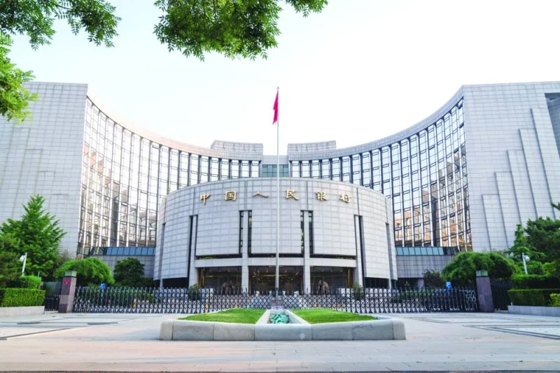 The People’s Bank of China headquarters building in Beijing. A broad array of Chinese data yesterday highlighted intensifying pressure on the economy from multiple fronts, prompting central bank to cut key policy rates to shore up activity but analysts say more support is needed to revitalise growth.