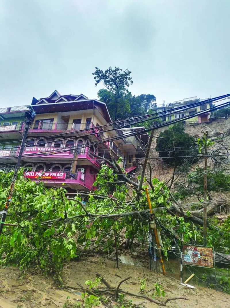 
A building is left partially damaged after a landslide caused by flash floods in Mandi, Himachal Pradesh, India. 