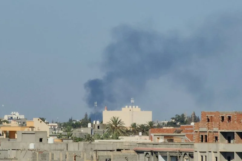 Smoke billows amid clashes between armed groups affiliated with Libya&#039;s Tripoli-based Government of National Unity (GNU) in the Libyan capital Tuesday. AFP
