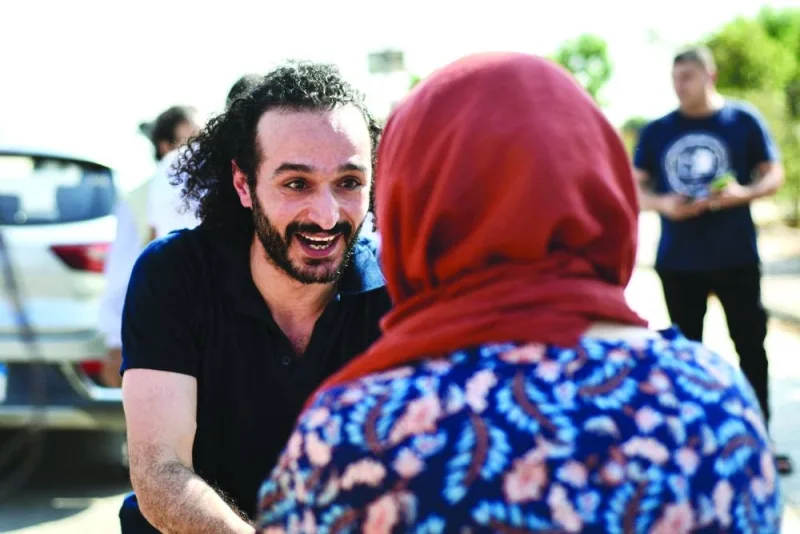 
Douma is greeted by a relative following his release from prison. 