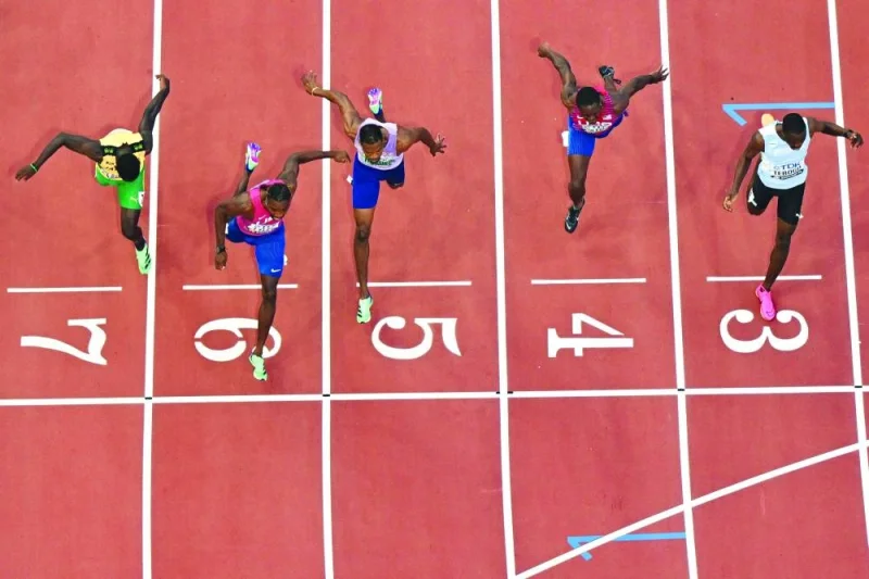 USA’s Noah Lyles (second from left and also inset) crosses the finish line to win the men’s 100m final during the World Athletics Championships at the National Athletics Centre in Budapest on Sunday. (AFP)