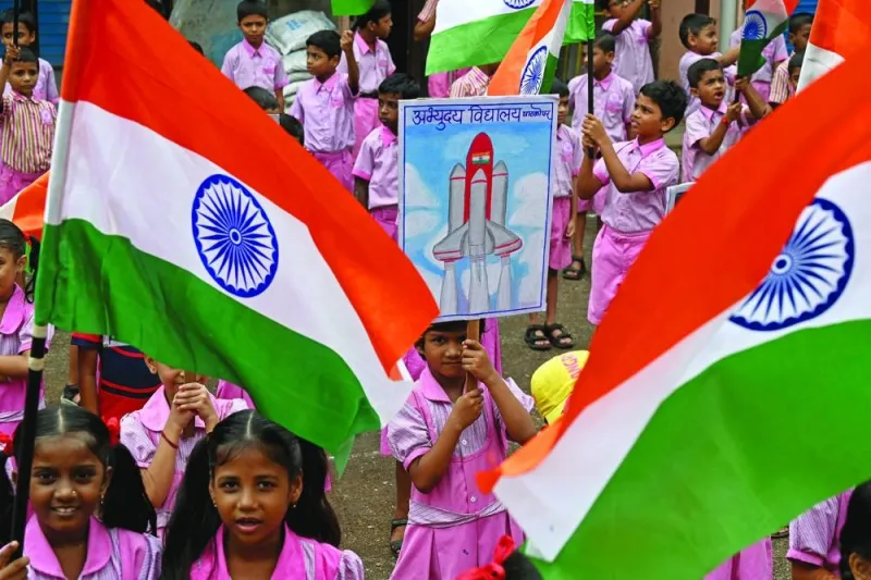 
Students wave India’s national flag as they gather in support of the Chandrayaan-3 spacecraft in Mumbai yesterday. 