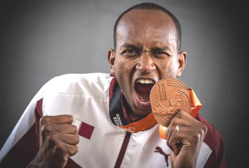 Men&#039;s high jump bronze-medallist Qatar&#039;s Mutaz Essa Barshim poses for portraits during a studio photo session on the sidelines of the World Athletics Championships at the National Athletics Centre in Budapest on Wednesday. (AFP)